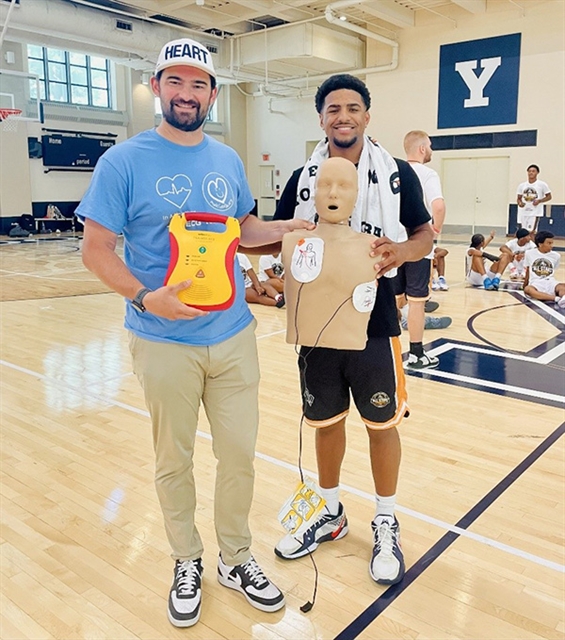 Mike Papale and fellow SCA survivor volunteering at a youth basketball camp